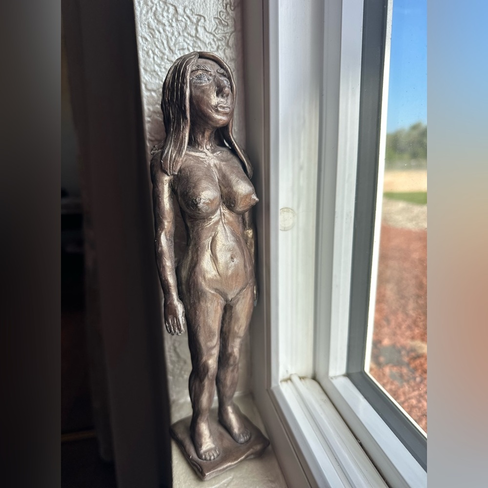 Elegant Bronze Female Sculpture